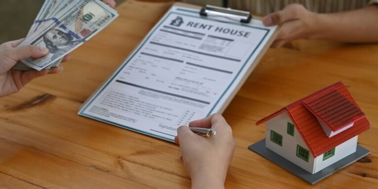 buyer is signing a purchase agreement from broker real estate and mortgages FEATURED IMAGE