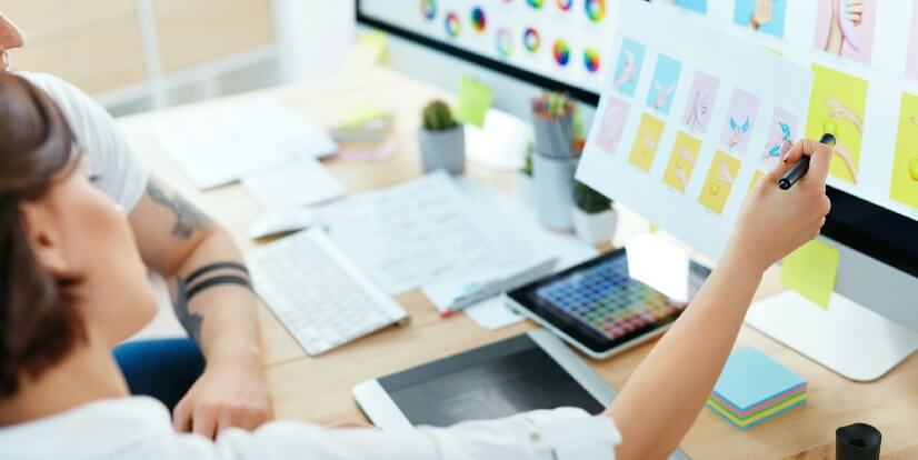 web design close up of designers working on web project people sharing ideas working on computer in office high resolution FEATURED IMAGE