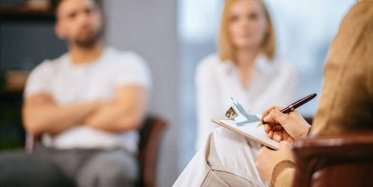 female psychologist taking notes on paper professional psychologist conducts mental health therapy to young married couple and writing all symptoms of patients try to help them therapy problems psychology people relationships concept FEATURED IMAGE