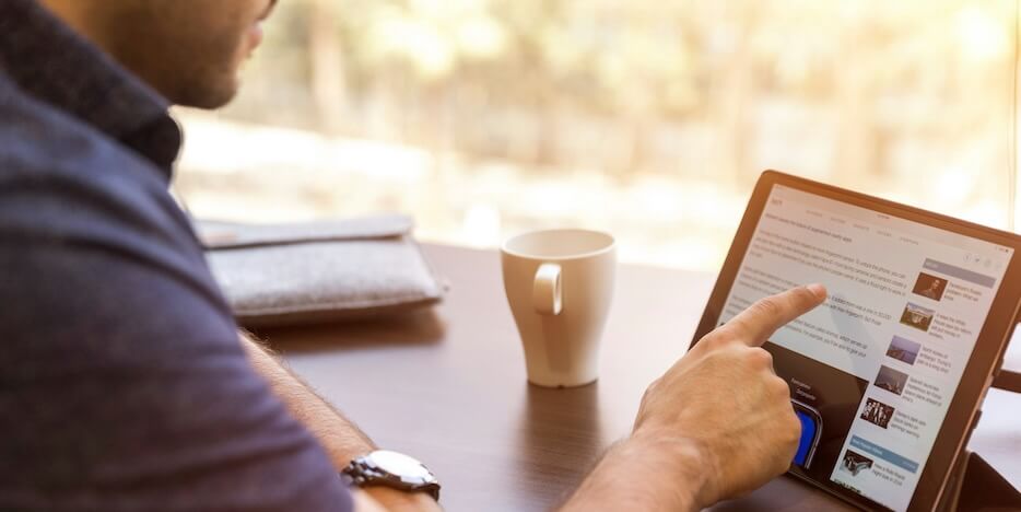 man holding tablet computer FEATURED IMAGE
