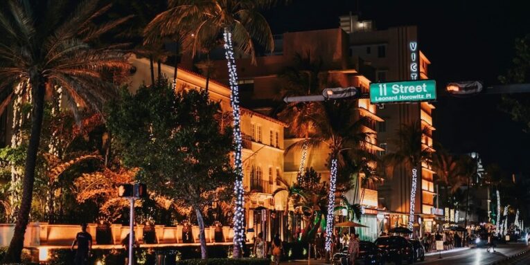 nighttime view of a street with illuminated buildings FEATURED IMAGE