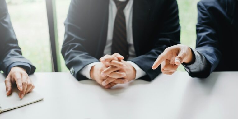 businessmen and lawyers meeting and discuss lawsuit in the office FEATURE IMAGE