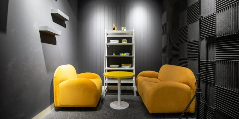 two yellow chairs in a podcast studio room FEATURED IMAGE