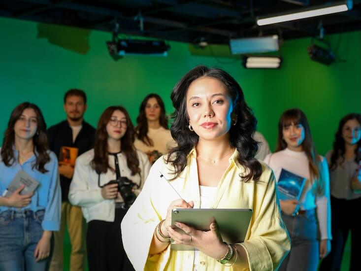 diverse media team in green screen studio