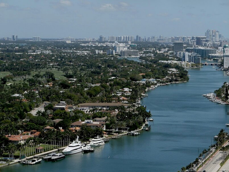 a river running through a city next to tall buildings