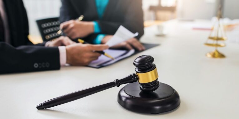 team of lawyers man working together on legal matters in the office FEATURED IMAGE