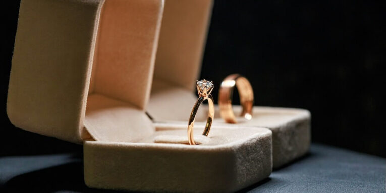 close up of the wedding rings of the bride and groom in a box FEATURED IMAGE