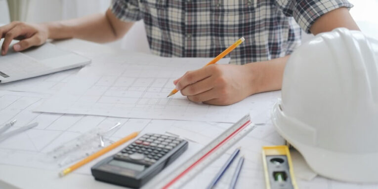 architect or engineer working in office construction concept engineering tools FEATURED IMAGE