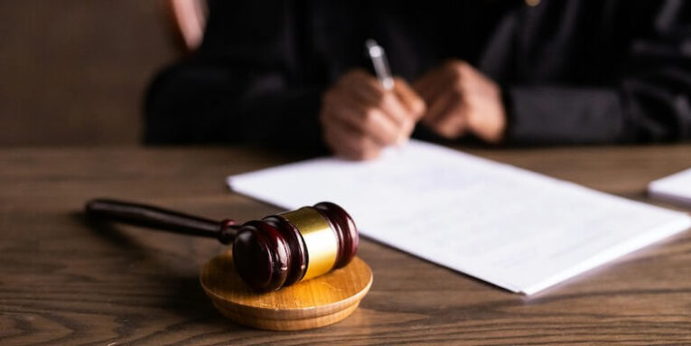 Judge Signing on the Papers FEATURED IMAGE