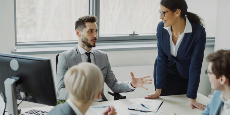 business professionals collaborating in a modern office meeting FEATURED IMAGE