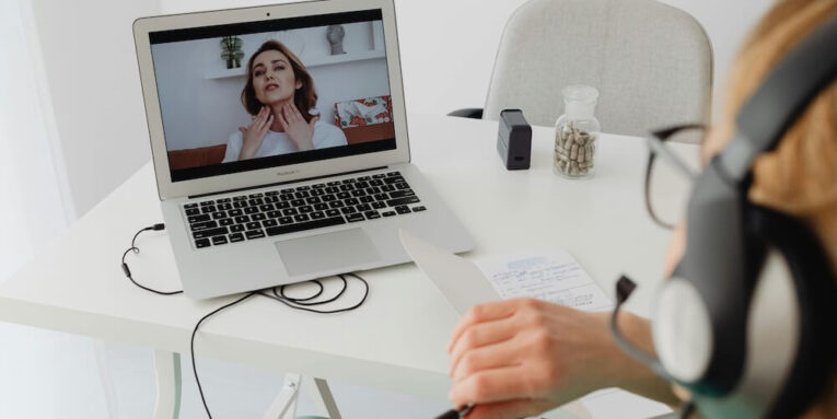 A healthcare professional video conferencing with a patient for an online consultation FEATURED IMAGE