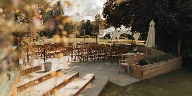a view of an outdoor wedding venue from a window FEATURED IMAGE