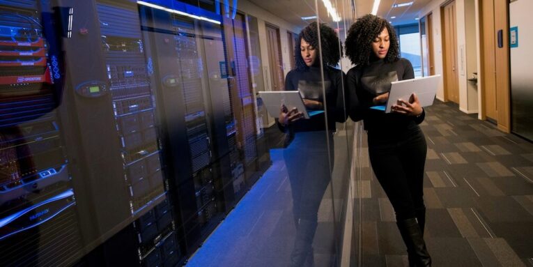 woman in black top using surface laptop FEATURED IMAGE