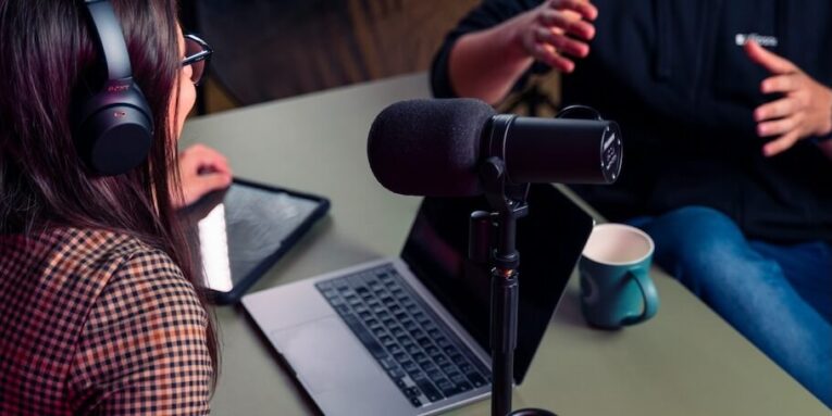 a person with headphones on using a laptop FEATURED IMAGE
