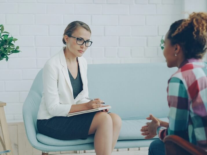 two women talking in a therapy session