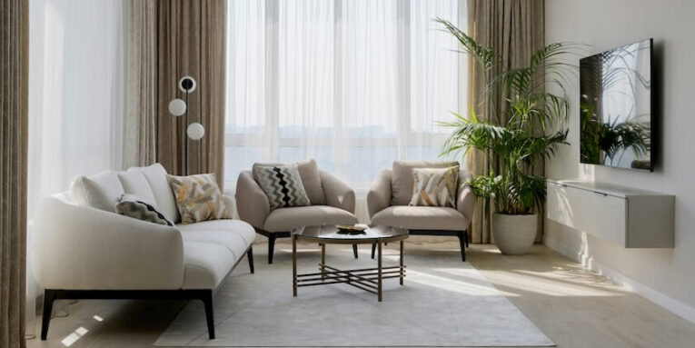 a living room with a large window FEATURED IMAGE