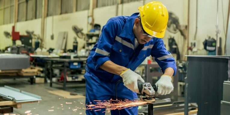 asian attractive man industrial worker working in manufacturing plant young handsome male industry factory engineer wear helmet and processes order and product at manufactory warehouse with happiness FEATURED IMAGE