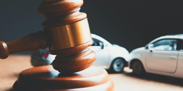 a toy car and a wooden gaven on a table FEATURED IMAGE