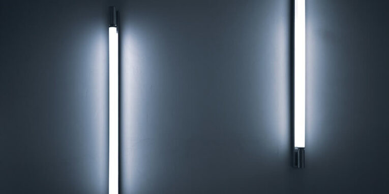 a couple of lights that are on a wall FEATURED IMAGE