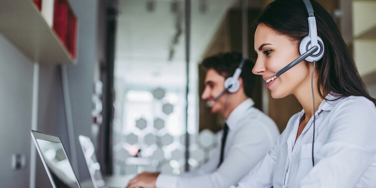 how can I help you beautiful call center workers in headphones are working at modern office FEATURED IMAGE