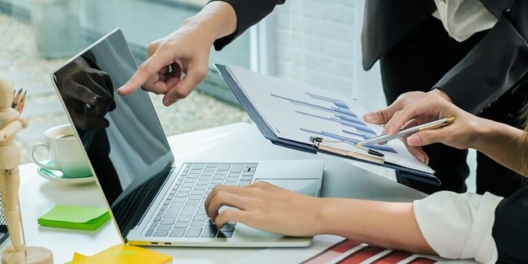 business people brainstorming ideas for business investment strategies charts and documents for business FEATURED IMAGE