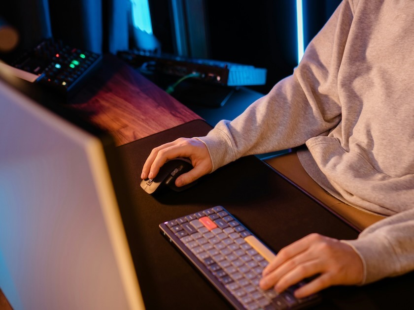 a man sitting in front of a laptop computer