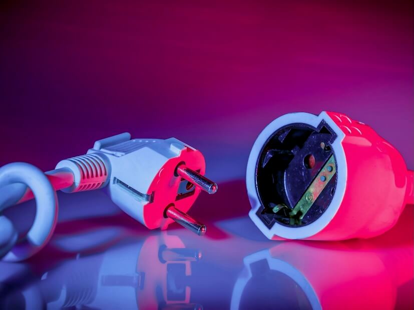 a close up of a red and white electrical device