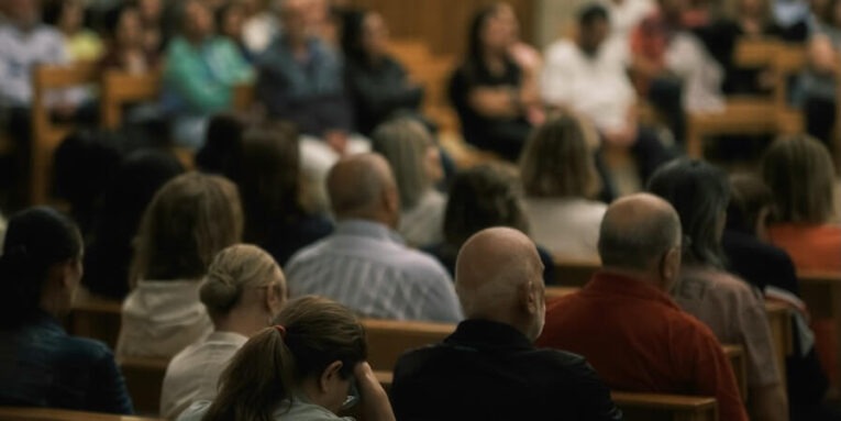 audience seated in a church during a service FEATURED IMAGE