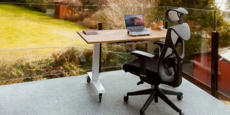 a chair with a laptop on top of it FEATURED IMAGE