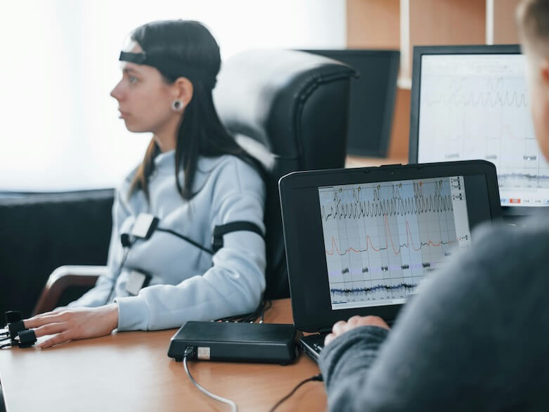 girl passes lie detector in the office asking questions polygraph test