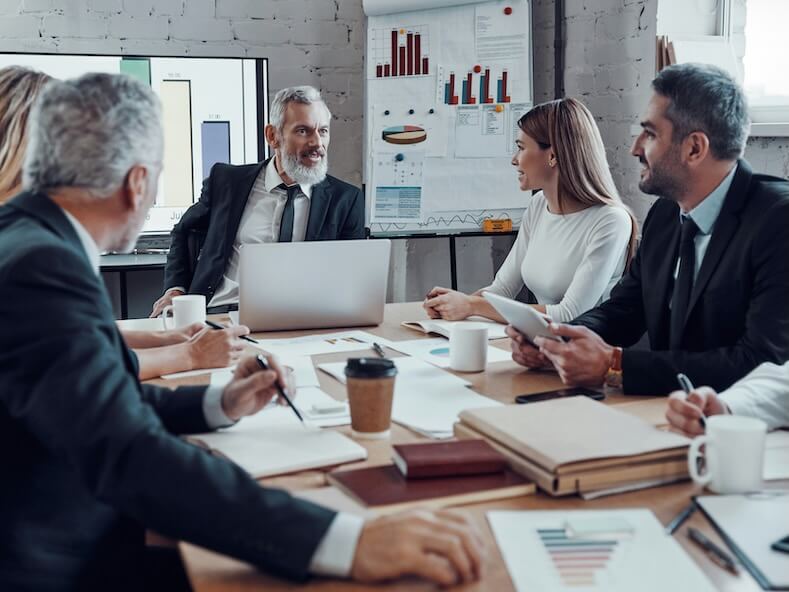 modern business people communicating with each other while working together in the board room
