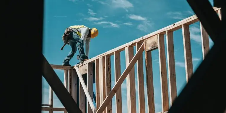 construction worker in hard hat on building frame FEATURED IMAGE
