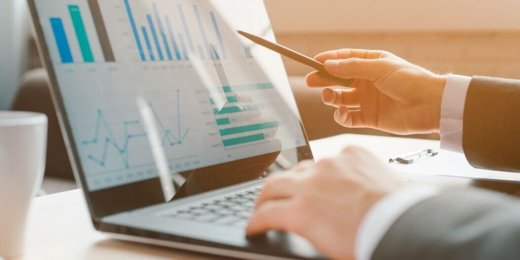 person analyzing business charts on laptop FEATURED IMAGE
