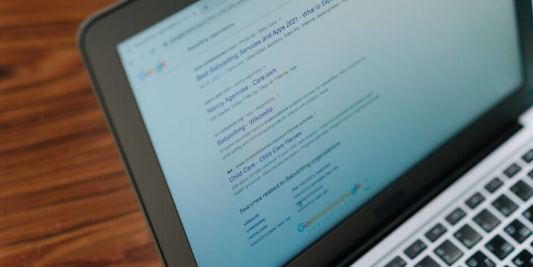 A close-up view of a laptop displaying a search engine page FEATURED IMAGE