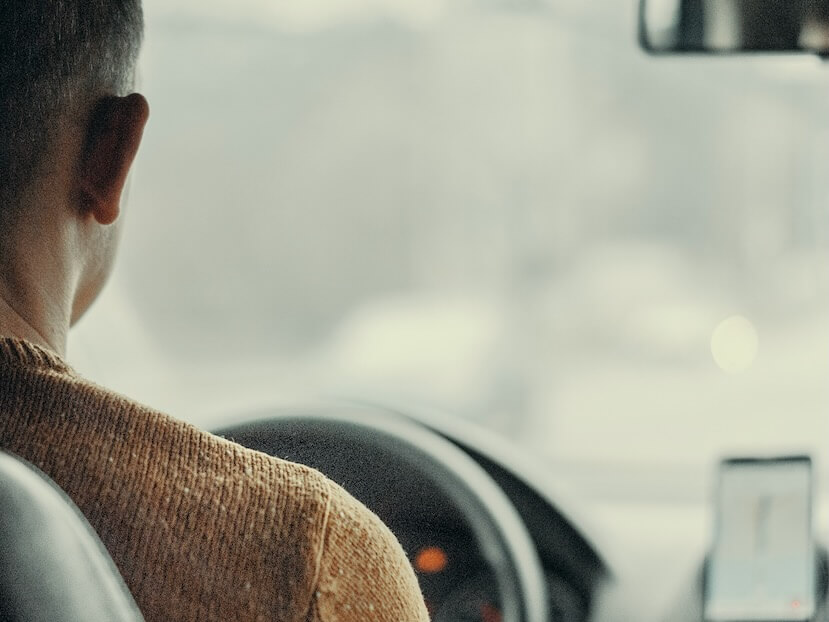 man driving vehicle