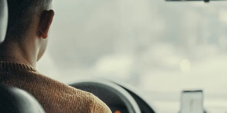 man driving vehicle FEATURED IMAGE