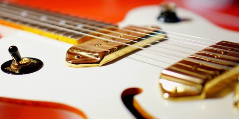 white and red electric guitar FEATURED IMAGE